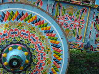 Blue ox cart with decorative painted wheel at ox cart parade in Escazu, Costa Rica